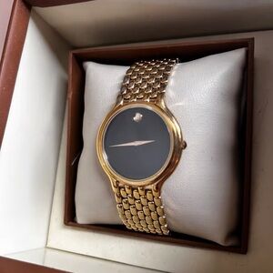 Movado Women's Gold Watch with Black Dial